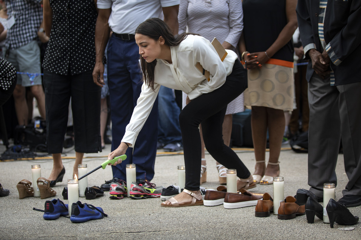 Representative Alexandria Ocasio-Cortez (D-New York) lights a candle during a vigil for the victims of the recent mass shootings in El Paso, Texas, and Dayton, Ohio, in Grand Army Plaza on August 5th, 2019, in Brooklyn. Lawmakers and local advocates called on Congress to enact gun control legislation and encouraged citizens to vote for politicians who would support those measures.