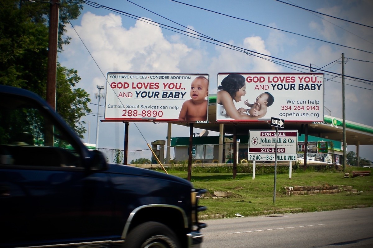 Signs for COPE Pregnancy Center in Montgomery, Alabama.