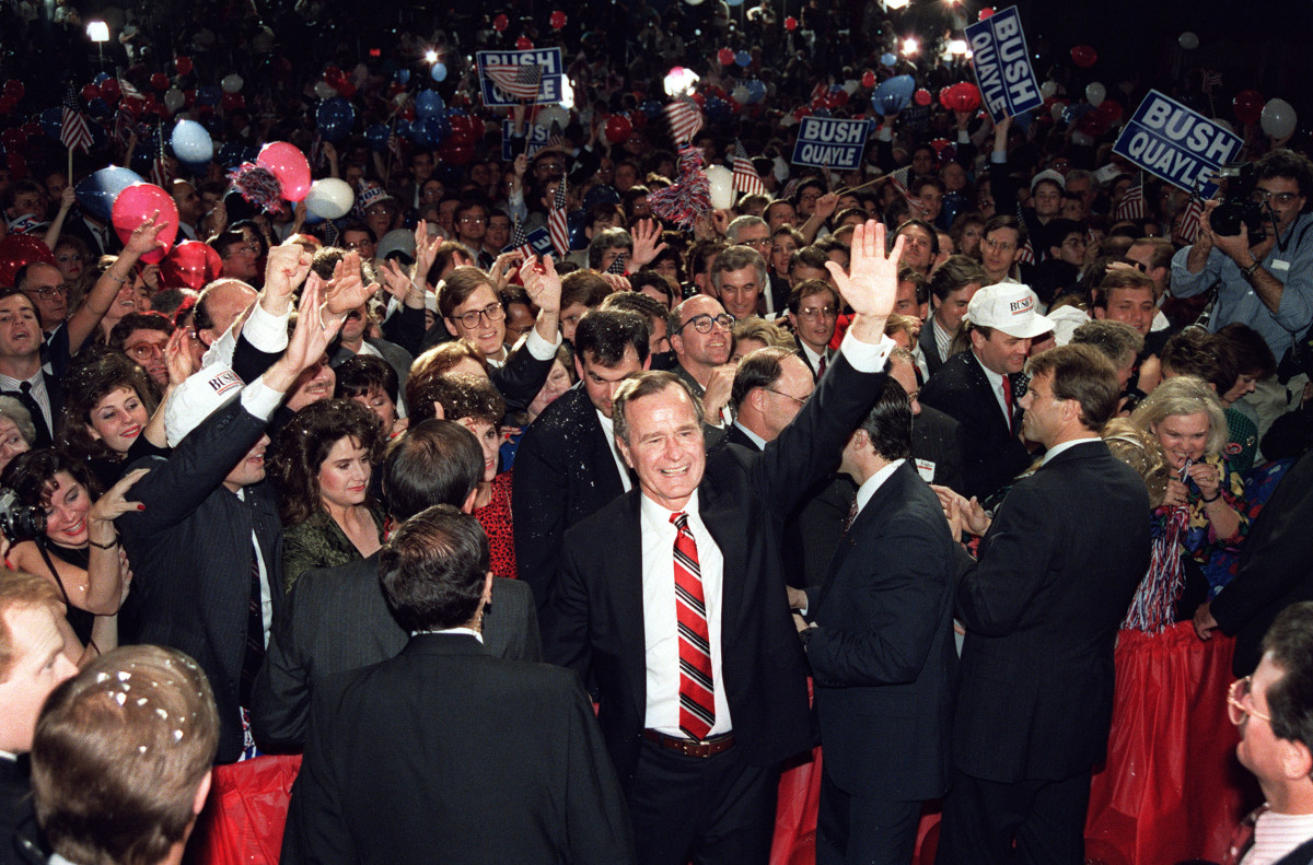 George H.W. Bush wades through the crowd on November 8th, 1988, following his acceptance speech at the Brown Convention Center, in Houston, Texas.