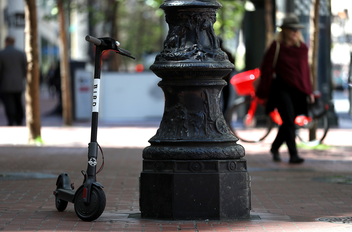 A Bird scooter sits parked on a street corner on April 17th, 2018, in San Francisco, California.
