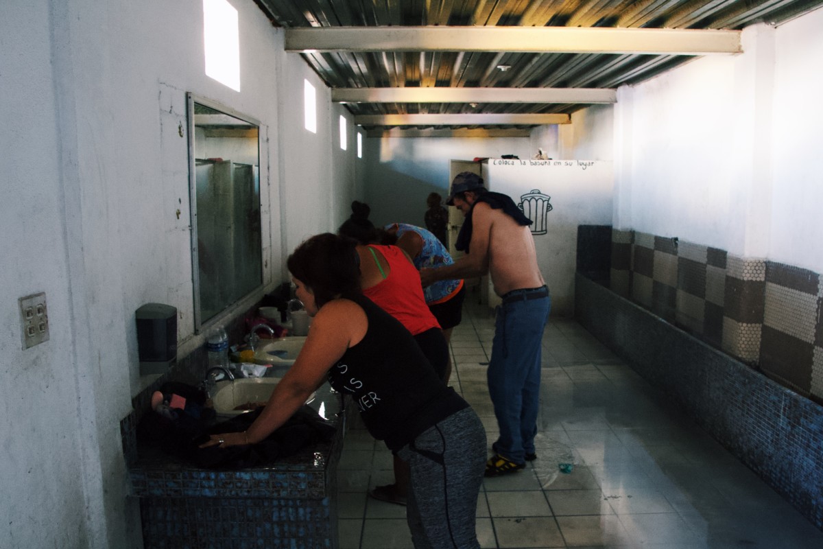This row of sinks are the "baths" for the most of the migrants in the camp. Here, migrants wash both their bodies and clothes.