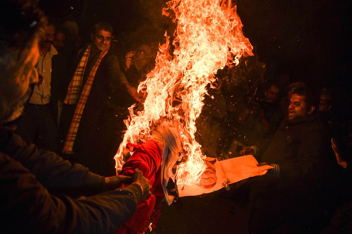 Indian Hindu activists burn an effigy of Chief Minister of Kerala Pinarayi Vijayan during a demonstration in the southern state of Kerala, in New Delhi, on January 3rd, 2019. Clashes broke out in southern India for a second day on January 3rd as Hindu hardliners went on a rampage, seeking to enforce a general shutdown in protest over two women entering Sabarimala Ayyapa, one of the country's holiest temples. The women were the first to enter the temple since a historic ban was lifted. A day after violence—both among rival groups and with police—left one man dead and 15 people injured; authorities said that 266 protesters had been arrested across the state of Kerala.