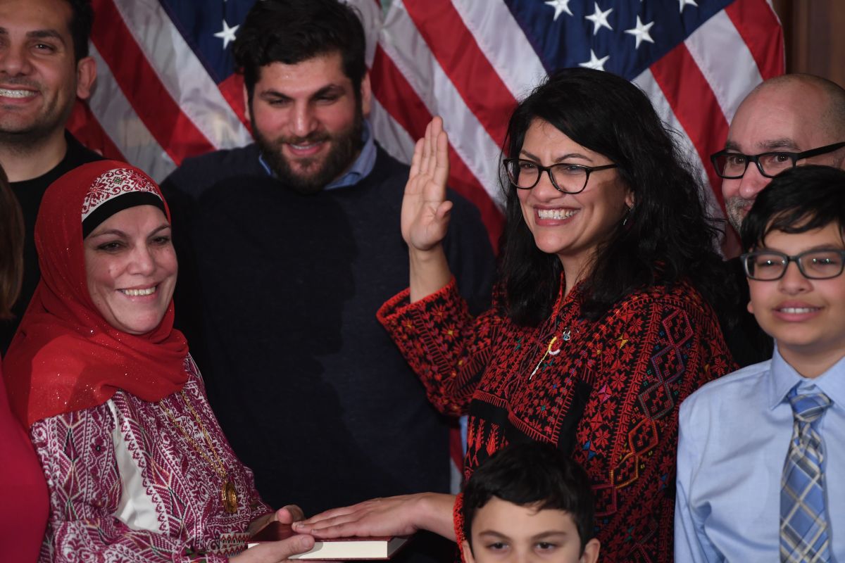 Representative Rashida Tlaib (D-Michigan), wearing a traditional Palestinian robe, takes the oath of office on Thomas Jefferson's Quran, with family members present in a swearing-in ceremony at the start of the 116th Congress at the U.S. Capitol in Washington, D.C., on January 3rd, 2019.