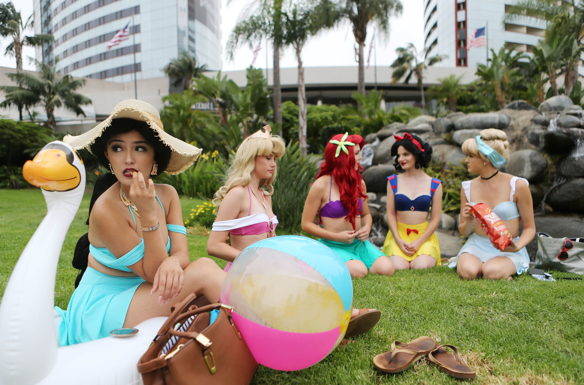 Cosplayers dressed as the Disney princesses lounging outside Comic-Con in San Diego, California, on July 20th, 2018.