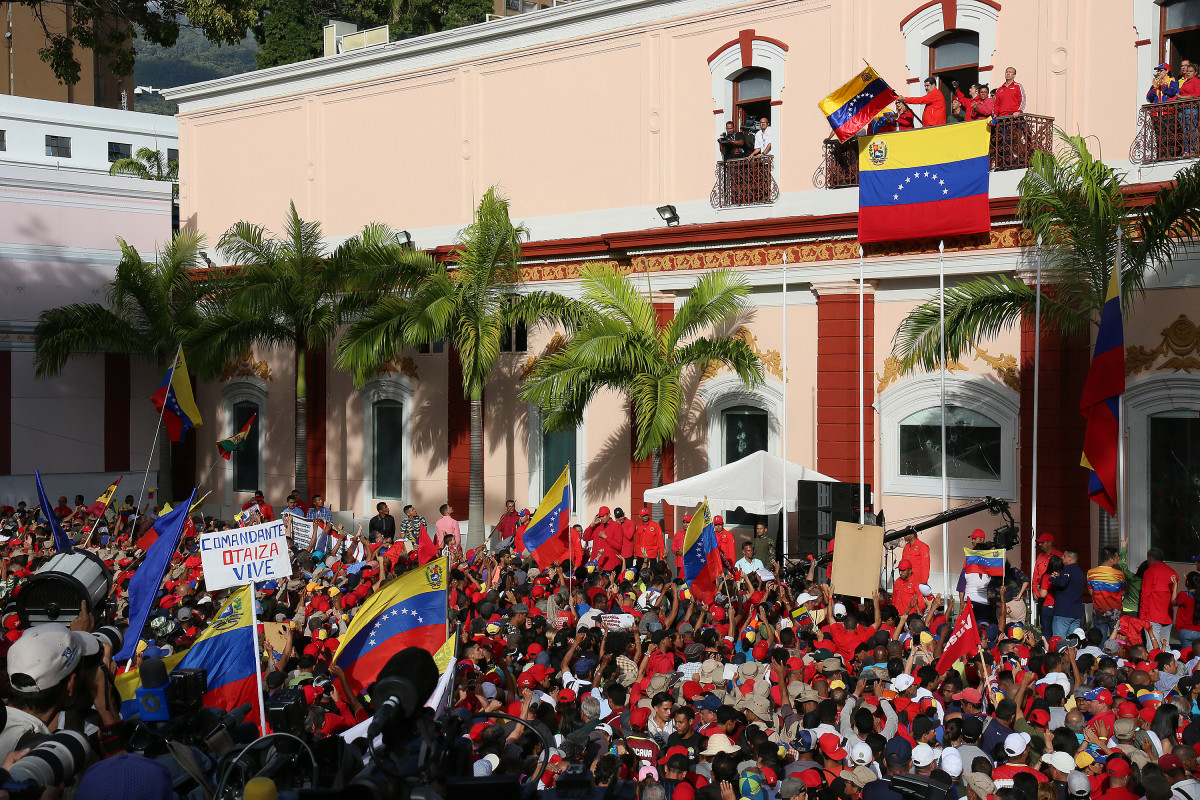 President of Venezuela Nicolás Maduro (center) gives a speech to his supporters from the Balcón del Pueblo of the Miraflores Government Palace on Wednesday, January 23rd, 2019, in Caracas, Venezuela. Earlier on Wednesday, Venezuelan opposition leader and head of the National Assembly Juan Guaido claimed that he is the rightful interim president, as was officially accepted by presidents of many countries such as the United States, Brazil, Chile, Canada, and Argentina. Protests continue in Caracas; meanwhile, Maduro and President Donald Trump no longer recognize any relations between their two countries.