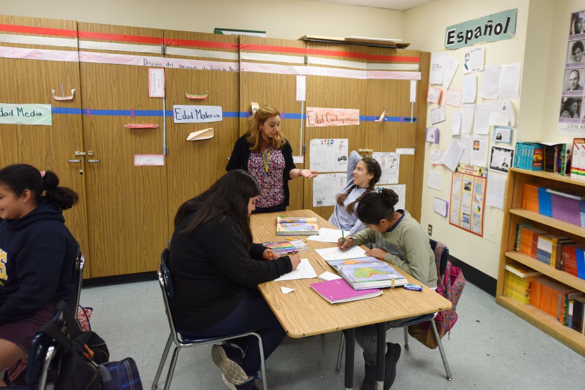 Instructor Blanca Claudio (standing) teaches a history lesson in Spanish in a Dual Language Academy class at Franklin High School in Los Angeles, California.