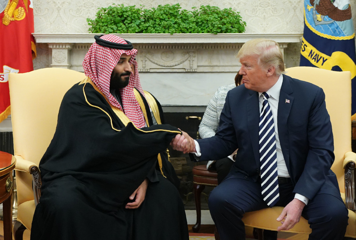 President Donald Trump shakes hands with Saudi Arabia's Crown Prince Mohammed bin Salman.