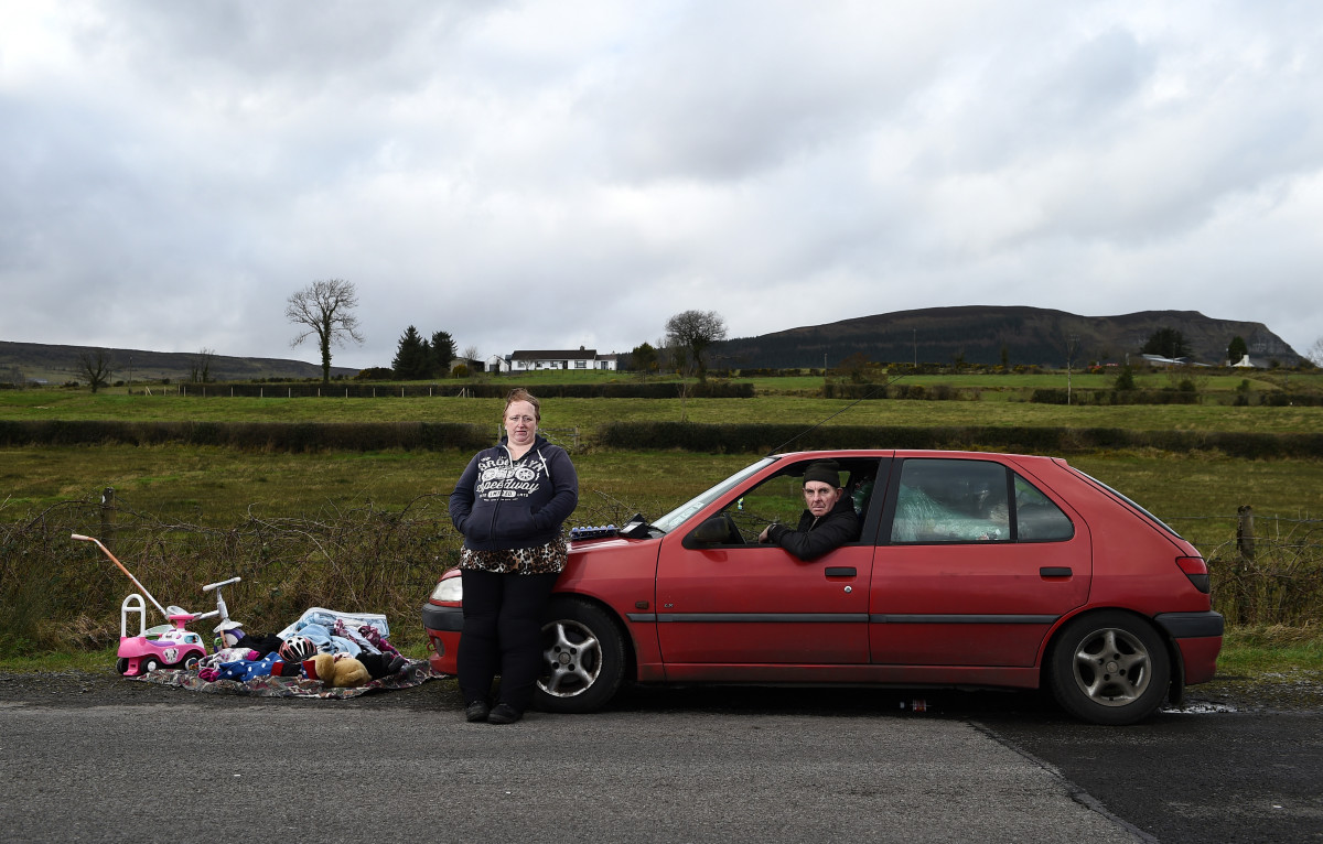 Stella Lynne and William Andrews pose for a photograph as they take part in the weekly market that takes place on the Irish border on February 17th, 2019, in County Fermanagh, Northern Ireland. The couple, who are Democratic Unionist Party voters, voted to remain in the E.U. Referendum in 2016 and now fear the return of a hard border. "It looks like the border is coming back, which won't be good," they said. "We've already started to gather tinned food just in case."
