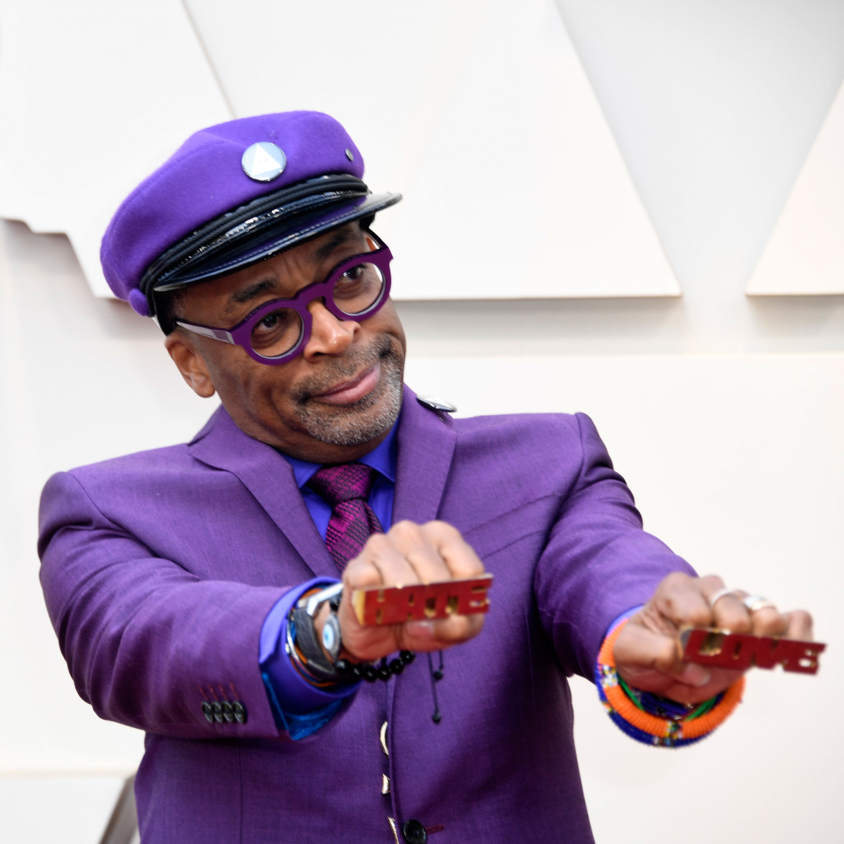 Spike Lee, director of BlacKkKlansman, attends the 91st Annual Academy Awards on February 24th, 2019, wearing the "Love" and "Hate" rings from his 1990 film, Do the Right Thing.