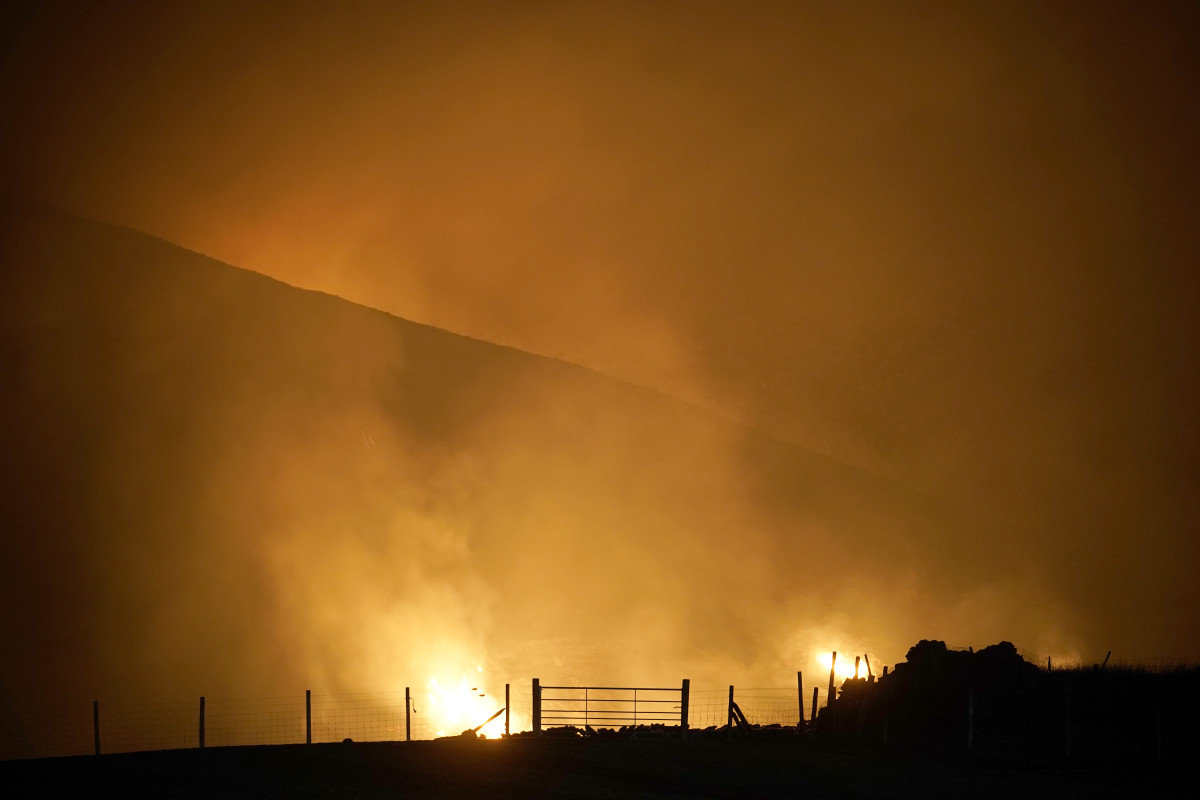 A moorland fire burns on Saddleworth Moor on February 27th, 2019, near Marsden, England. Plumes of smoke were visible for miles, with published reports noting the blaze covered approximately 1.5 square kilometers of the moor near Dovestone Reservoir. The fire comes after the U.K. recorded its warmest-ever February day on the 26th.