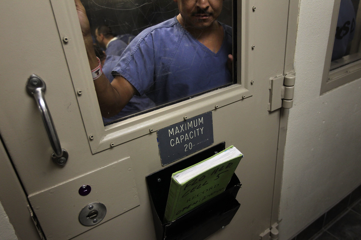 An immigrant stands in a holding cell at the U.S. Immigration and Customs Enforcement detention facility for illegal immigrants on July 30th, 2010, in Florence, Arizona.