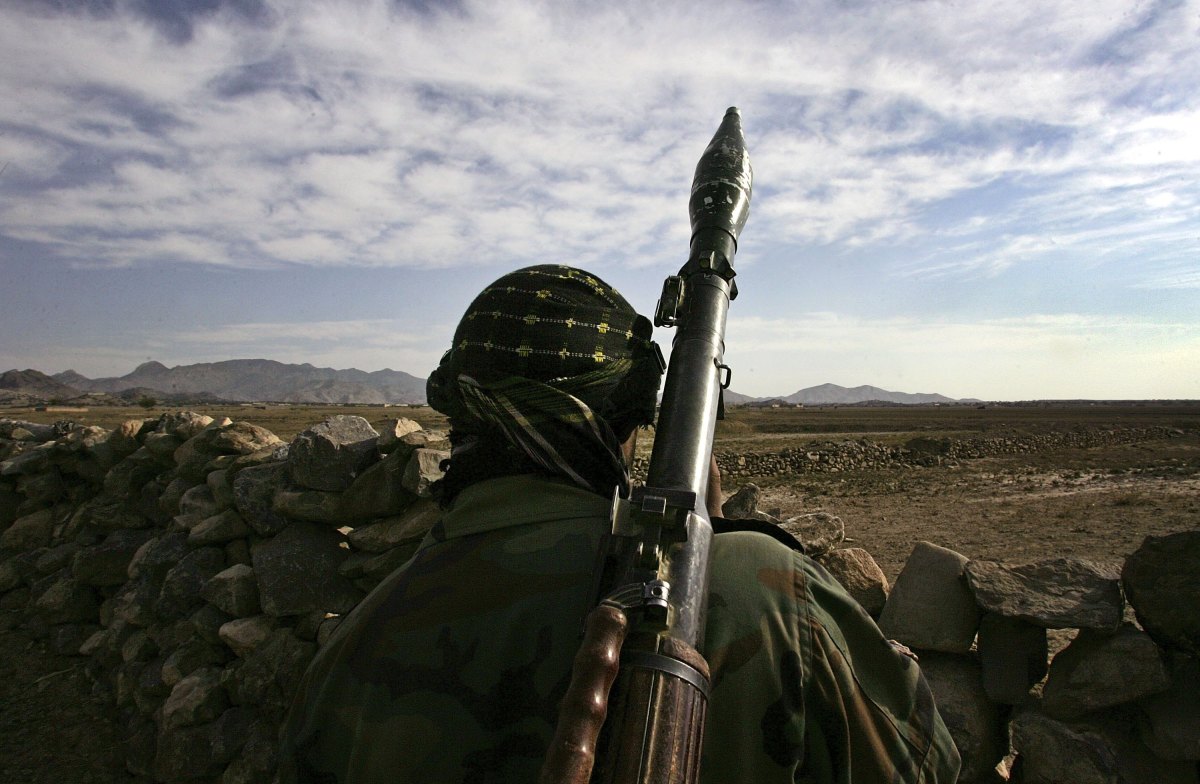 An Afghan National Army soldier looks toward the Pakistani border only 200 meters away.
