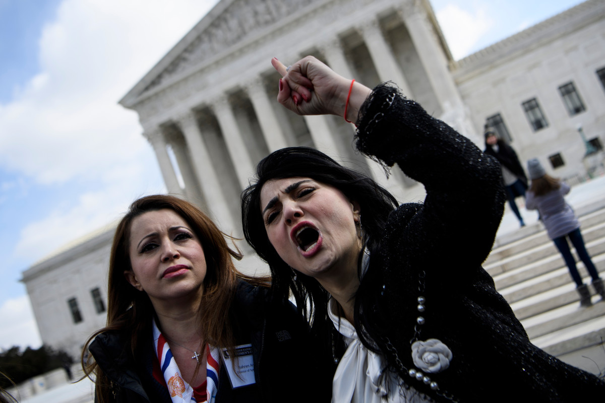 Nahren Anweya (left) and Rabia Kazan (right), of the Middle Eastern Women's Coalition, call for the resignation of United States Representative Ilhan Omar (D-Minnesota) outside the U.S. Supreme Court in Washington, D.C., on March 6th, 2019. The same day, others held a press conference to support Omar in the midst of her controversial comments criticizing pro-Israel lawmakers for potential "allegiance" to a foreign country.