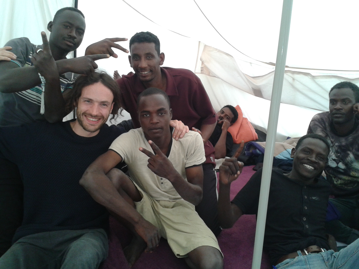 Refugees in the Calais Jungle pose with one of Pearce's friends during a 2016 visit.