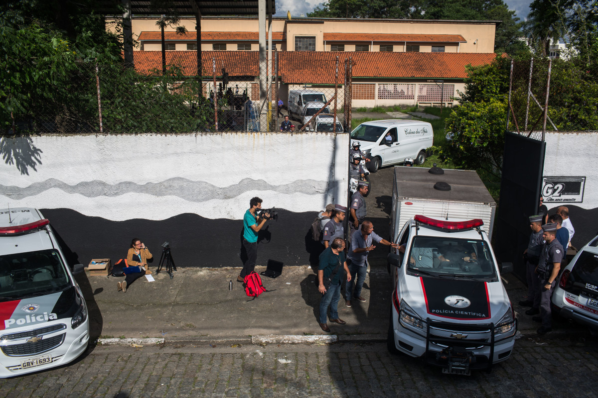 Funeral cars carrying bodies leave the public school where two former students opened fire on March 13th, 2019, in Suzano, Brazil. The gunmen killed at least 10 people and injured more than 20 others before killing themselves.