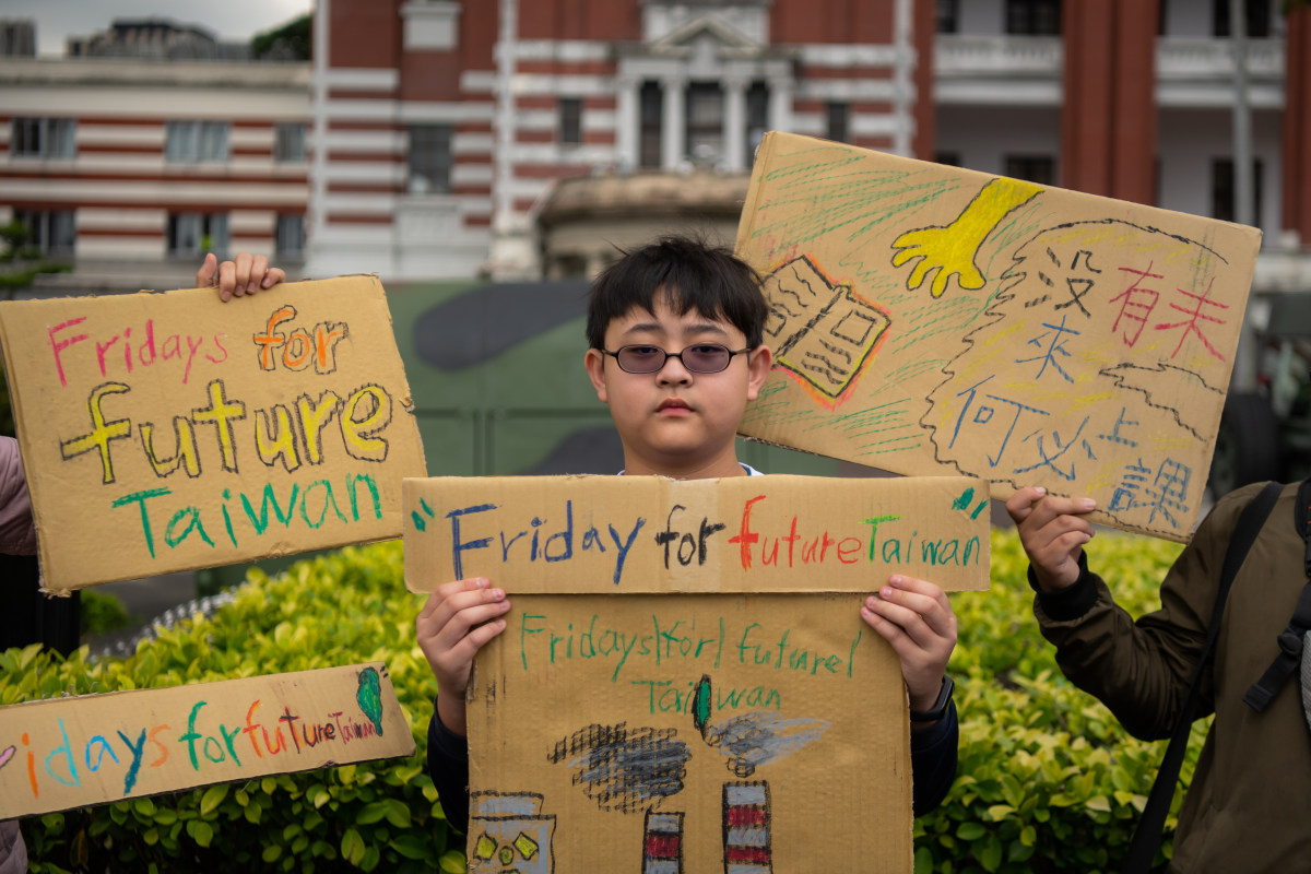 Yang Tzy-Ching, 12, a sixth grade student, takes part in the Global Climate Strike to protest climate change and government inaction in front of the Presidential Palace on March 15th, 2019, in Taipei, Taiwan.