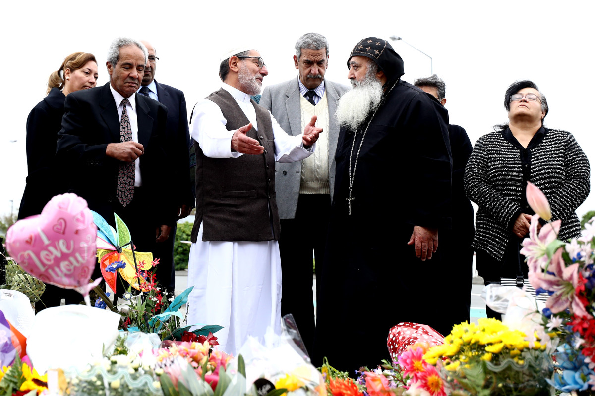 Imam of the attacked Linwood Mosque, Ibrahim Abdul Halim, walks with Father Felimoun El-Baramoussy, priest at St. Michael the Archangel Antiochian Orthodox Church in Dunedin to lay flowers outside the Linwood Mosque on March 18th, 2019, in Christchurch, New Zealand.