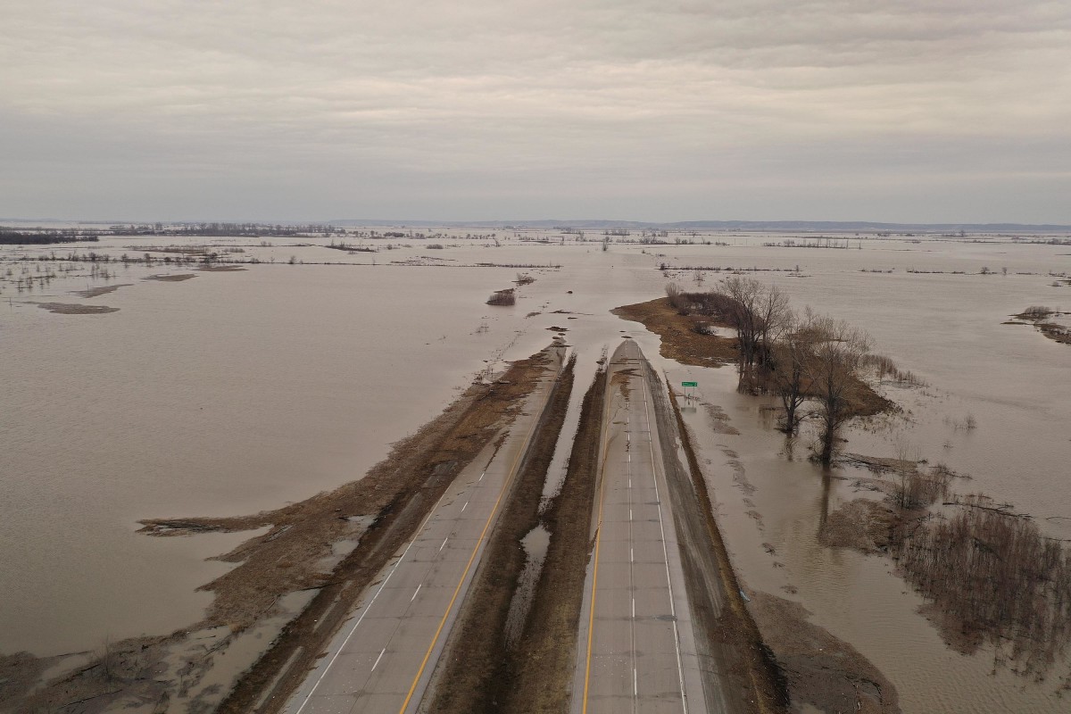 Following a bomb cyclone that dumped rain and melted snow across the Midwest, many sates—Iowa, Missouri, and Nebraska, especially—have experienced flooding. Pictured here, floodwater covers Highway 2 on March 23rd, 2019, near Sidney, Iowa.