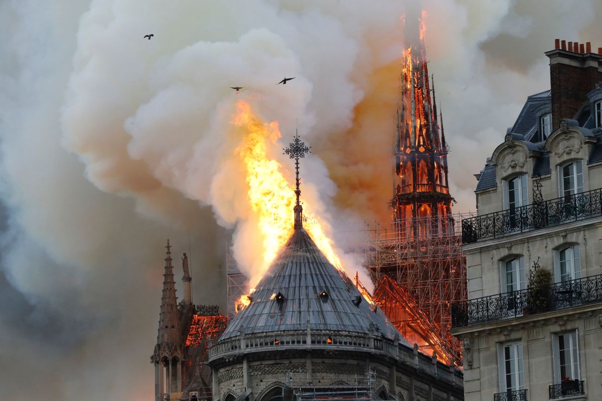 Smoke and flames rise during a fire at Notre Dame Cathedral in central Paris on April 15th, 2019.
