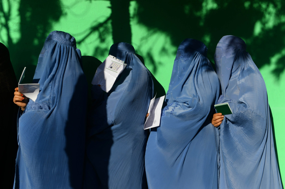 Afghan women wait in line to vote at a polling center in Herat Province on October 20th, 2018.