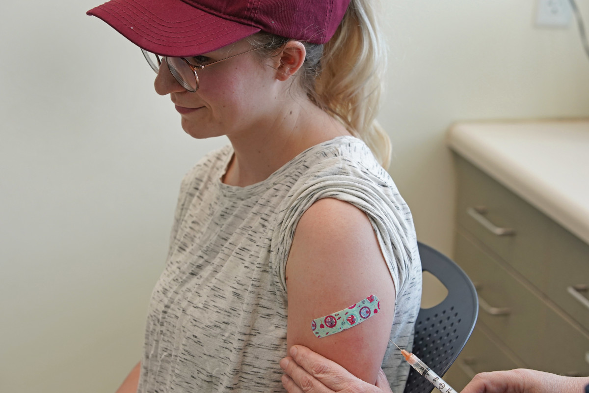 A nurse gives a woman a measles, mumps, and rubella virus vaccine at the Utah County Health Department on April 29th, 2019, in Provo, Utah.