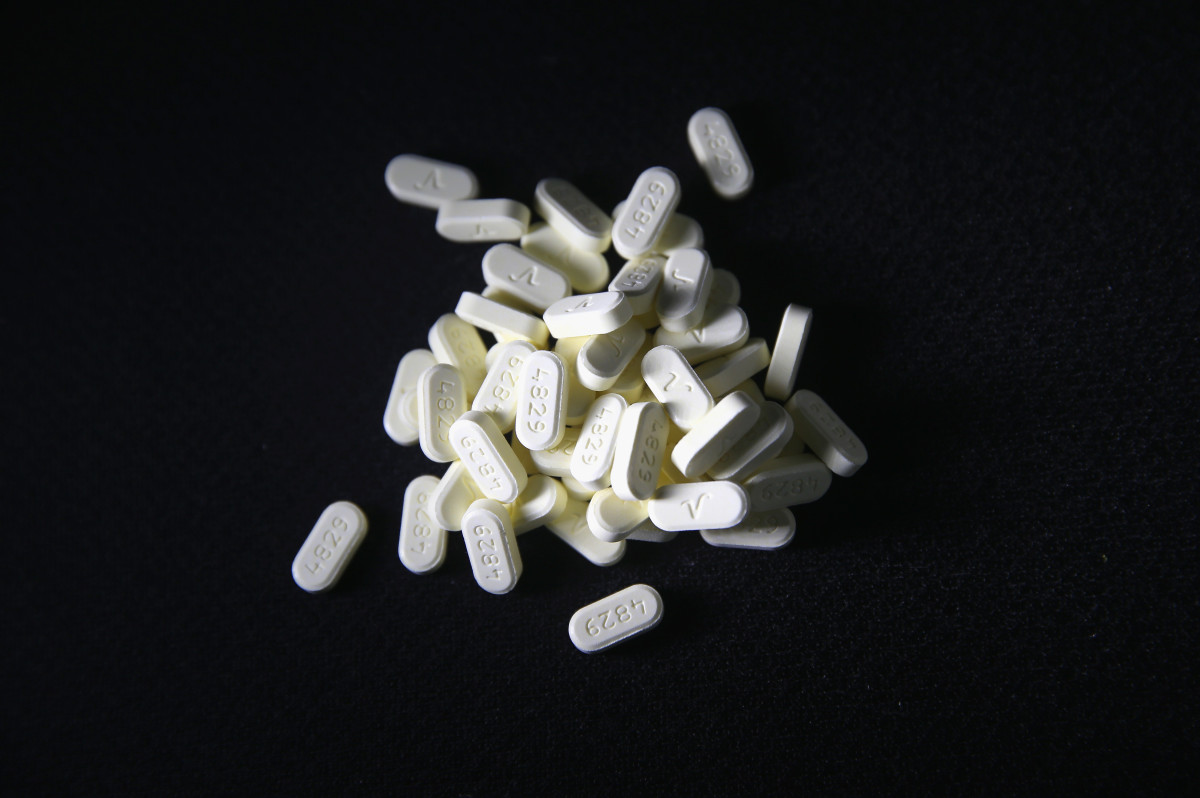 Oxycodone pain pills prescribed for a patient with chronic pain lie on display.