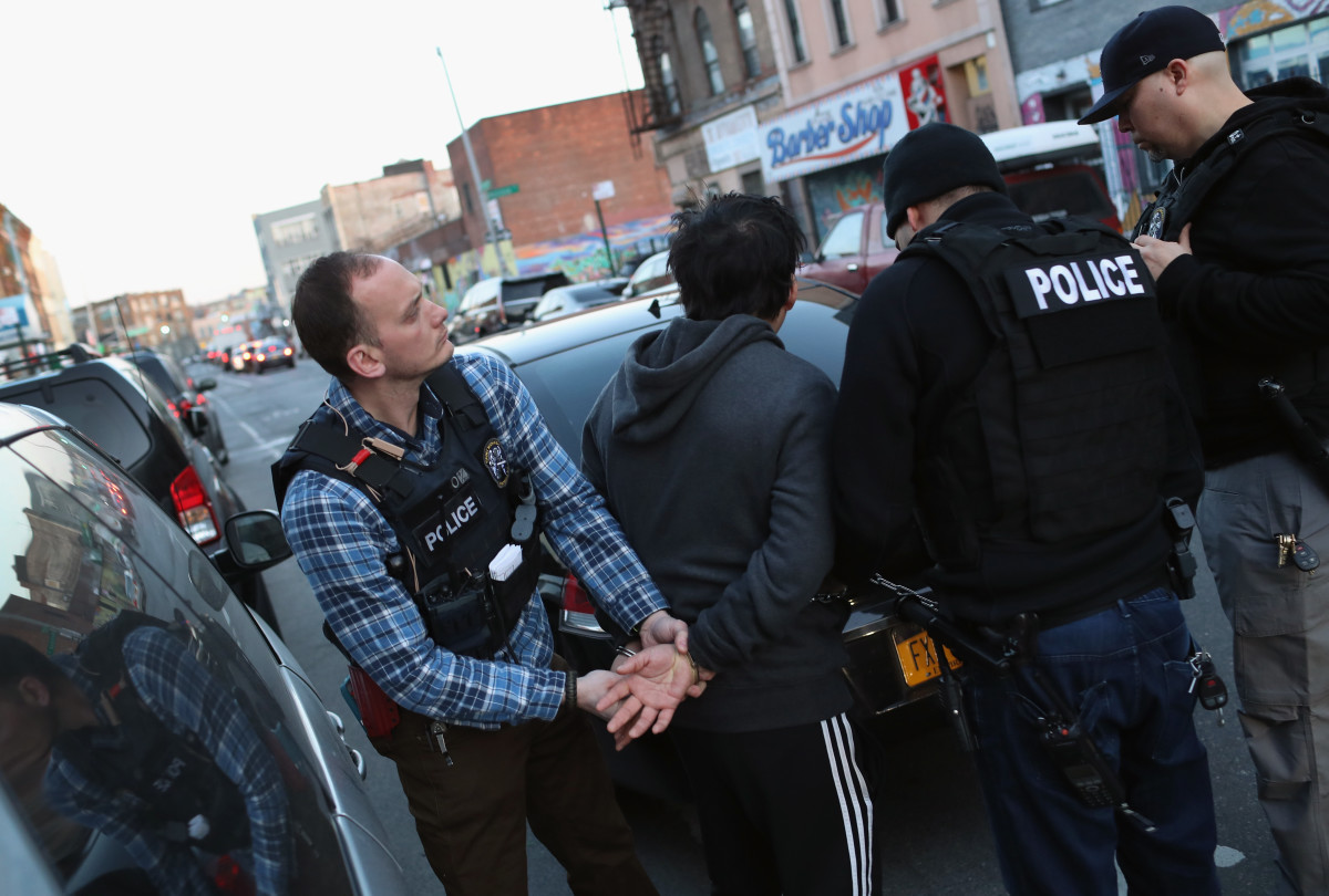 U.S. Immigration and Customs Enforcement officers arrest an undocumented Mexican immigrant during a raid in Bushwick, Brooklyn, in April of 2018.
