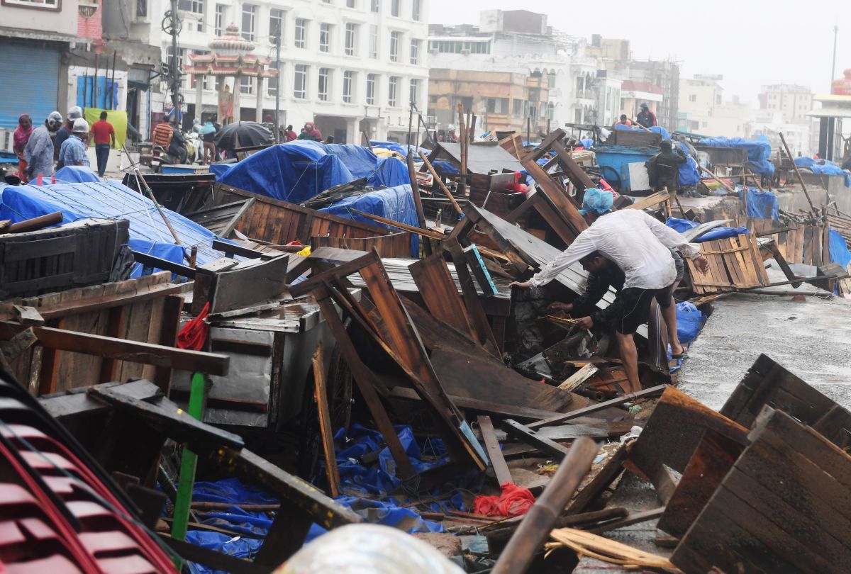 Indian residents inspect damages on street stalls at a promenade after Cyclone Fani landfall in Puri in the eastern Indian state of Odisha on May 3rd, 2019. Two people died on May 3rd after Cyclone Fani slammed into eastern India, officials said, as the storm sent coconut trees flying, blew away food stands, and cut off power and water. The monster weather system, which made landfall at the eastern holy city of Puri in the morning, is one of the strongest to come in off the Indian Ocean in years, with winds gusting at speeds of up to 125 miles per hour.