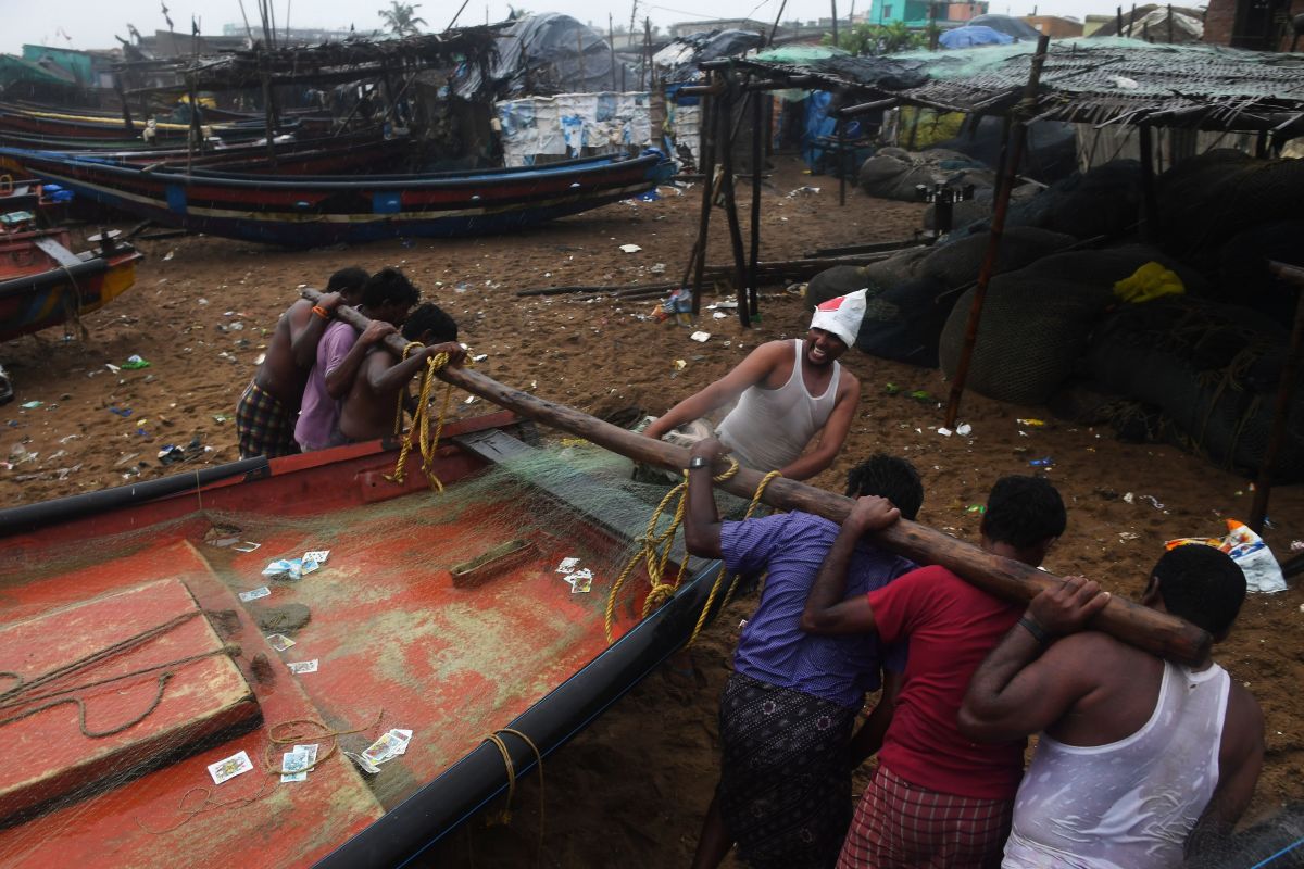 Indian fishermen pull a boat to higher ground on a beach in Puri in the eastern Indian state of Odisha on May 2nd, 2019, as Cyclone Fani approached the Indian coastline. Nearly 800,000 people in eastern India have been evacuated from the expected path of a major cyclone, officials said May 2nd.
