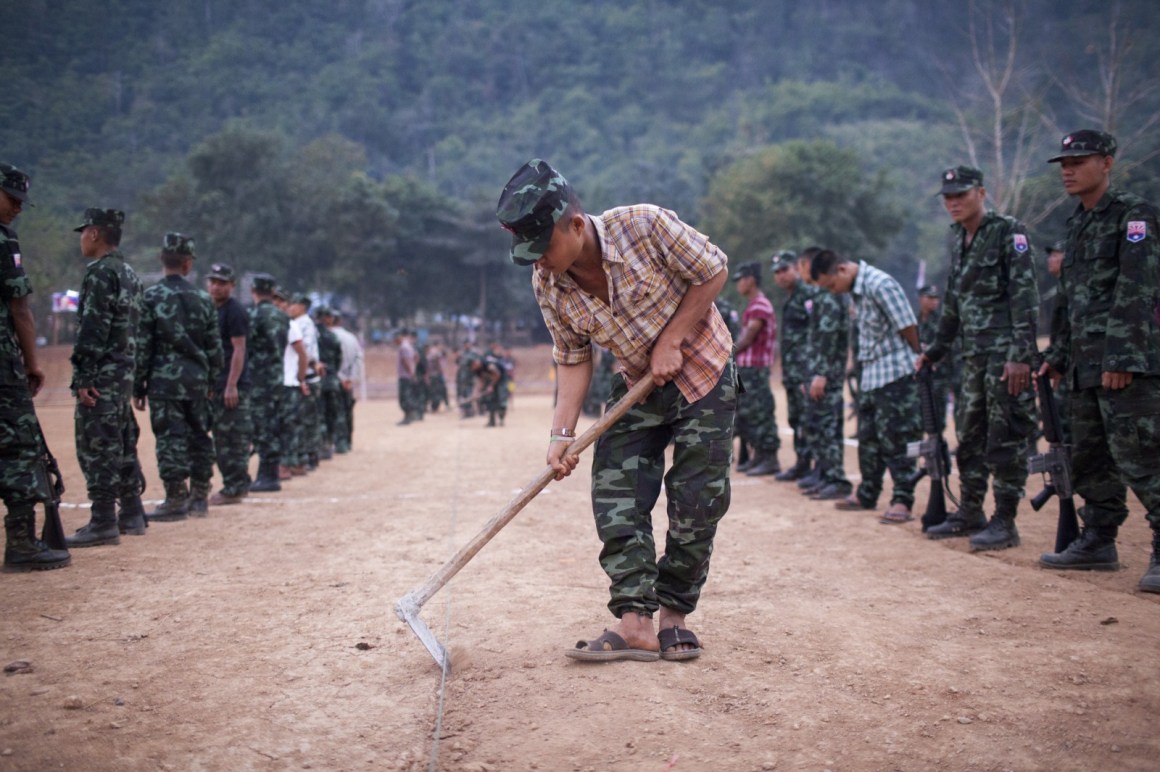 A Karen National Liberation Army soldier preparing the ground ahead of celebrations marking the 66th Karen Revolution Day in Myanmar's eastern Karen state in January of 2015.