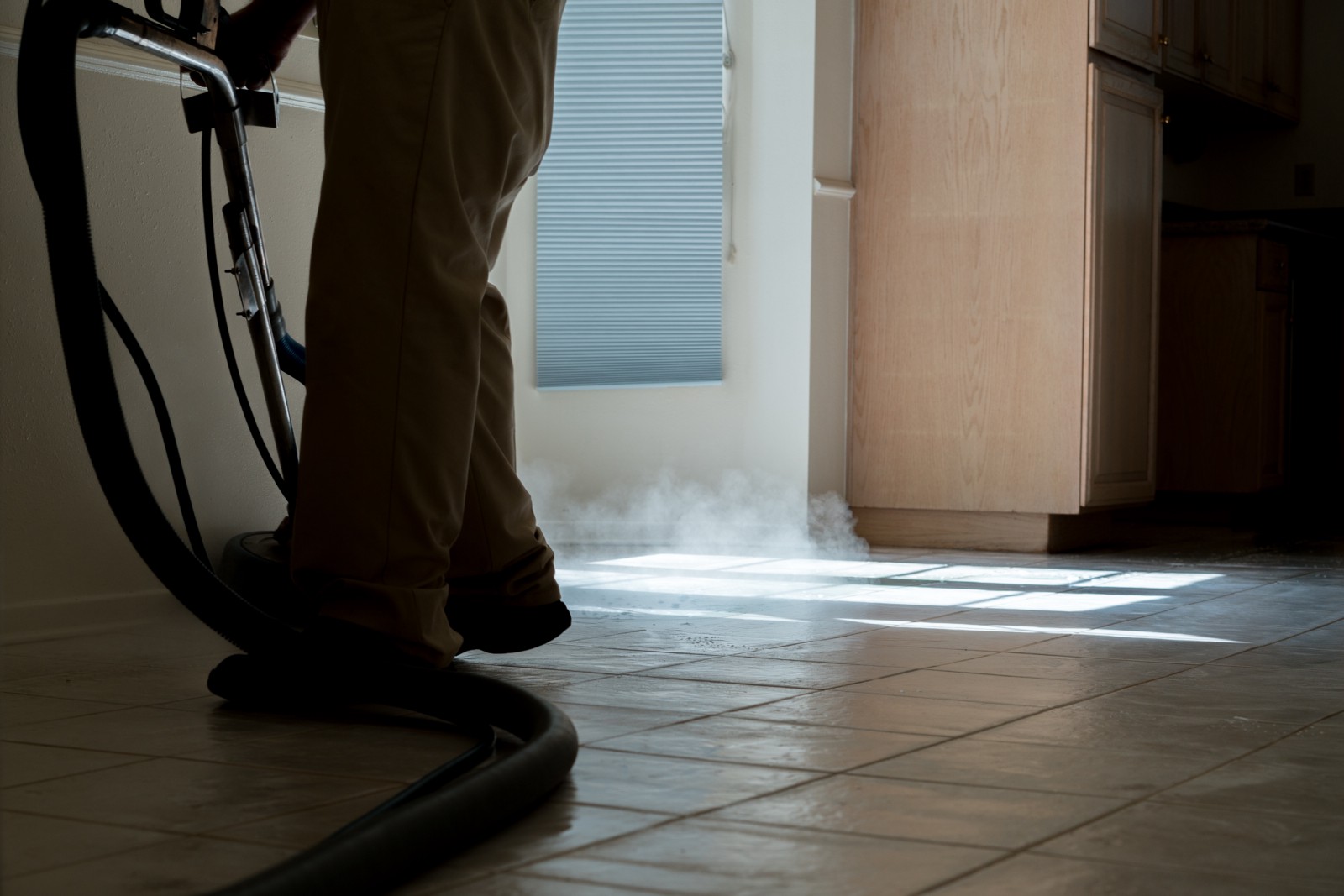 A man from a cleaning service washes the floors of a recently vacated home on Dunure Place in Porter Ranch on March 26. The home, which is up for sale, was vacated by the previous owners because of the gas leak. This is the second time it has been cleaned, according to the man.