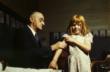 A doctor performing a typhoid vaccination in Texas, 1943.