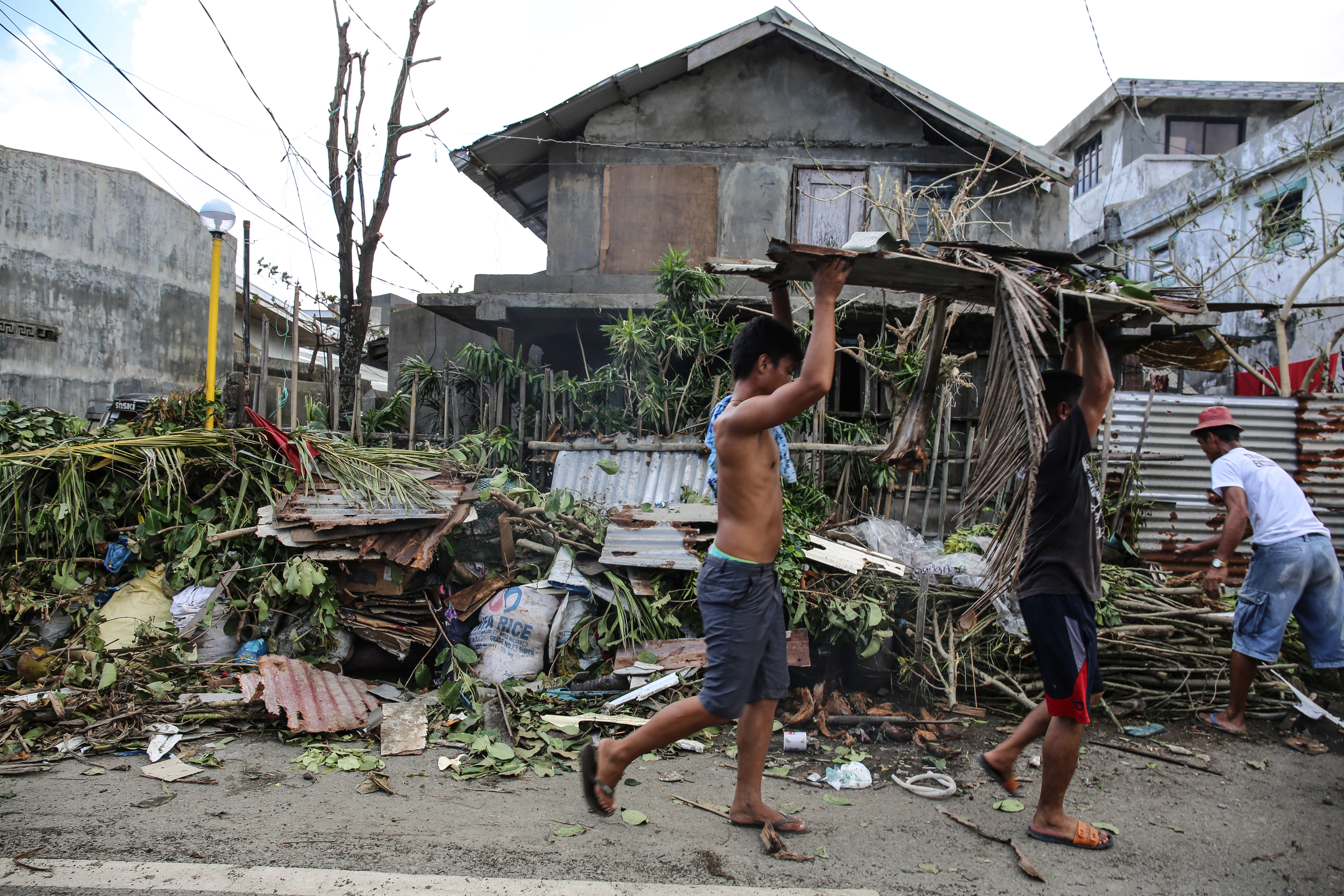 Clean-up begins in Aparri after Typhoon Manghut tore through its streets.