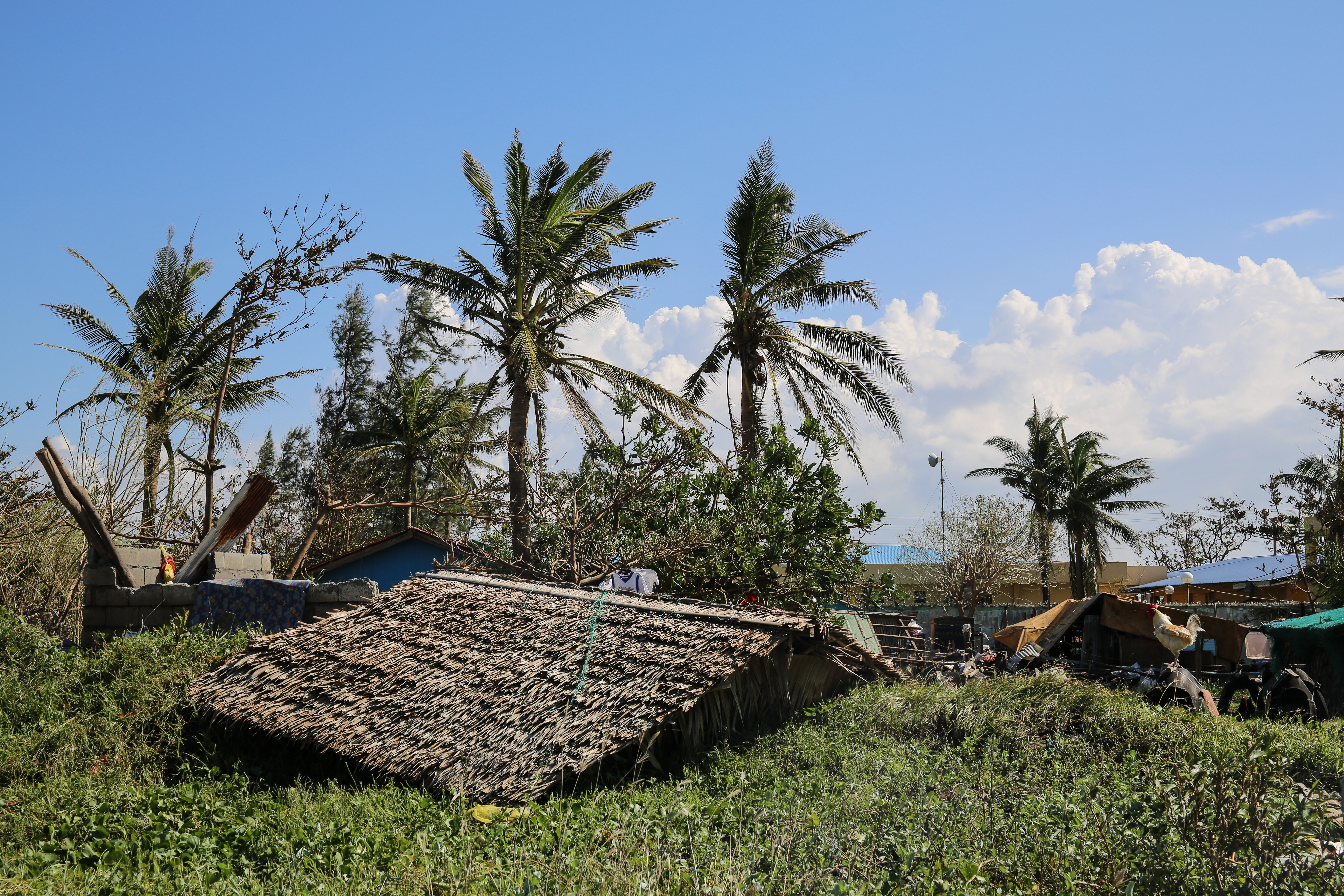 The roof of Maya Banadero's home lies next to the foundation. 