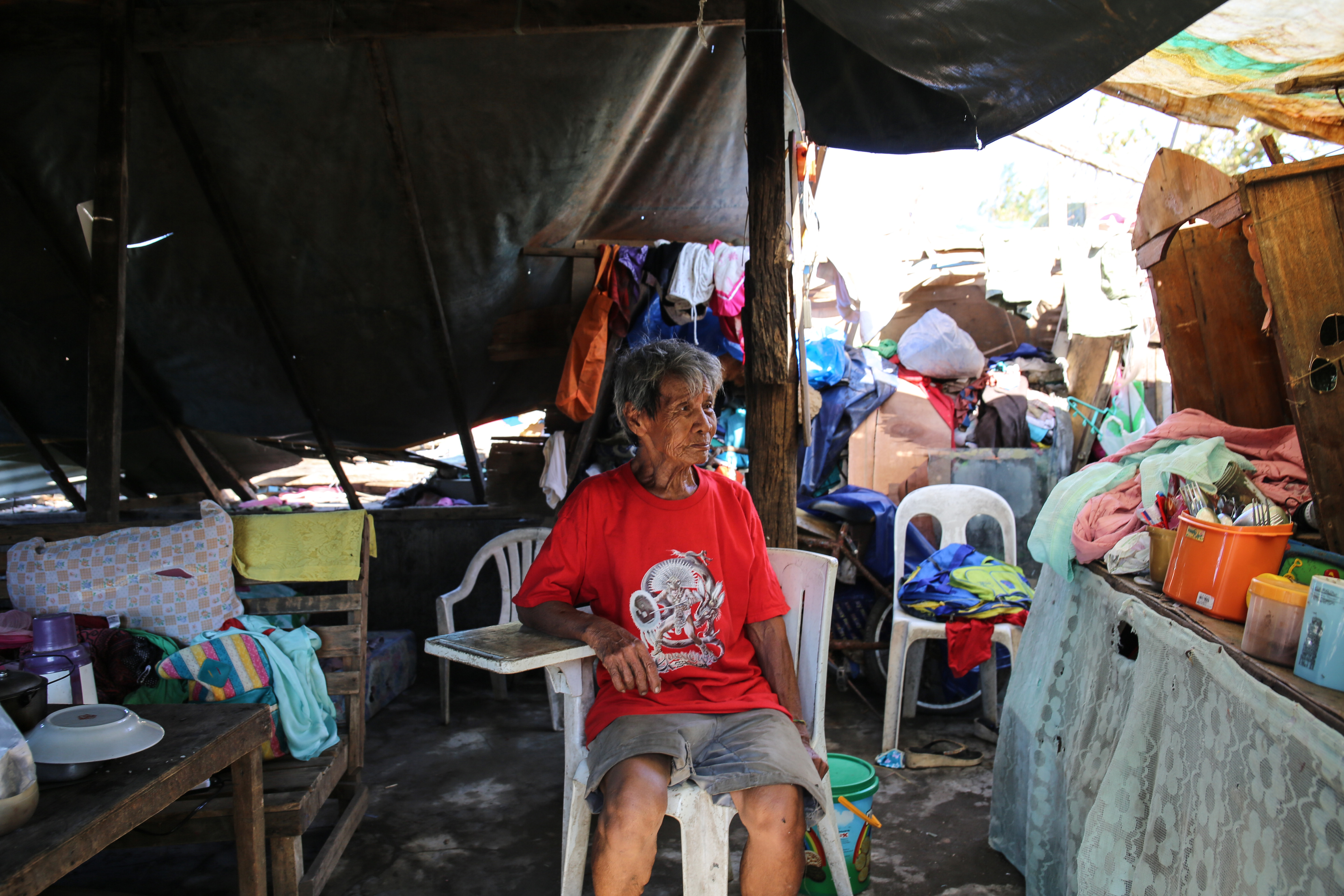 Jose Asedo's home sits close to the sea, making it a target for potential deadly storm surges. He has lived here for 15 years. Today, he put a sheet of tarpaulin over the space where his roof once was. 