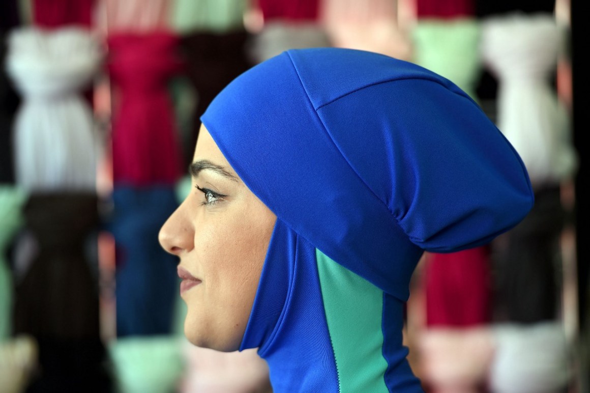 Profile photo of the head of a woman wearing a burkini swimsuit