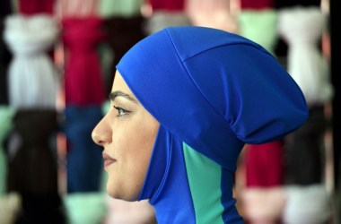 Profile photo of the head of a woman wearing a burkini swimsuit