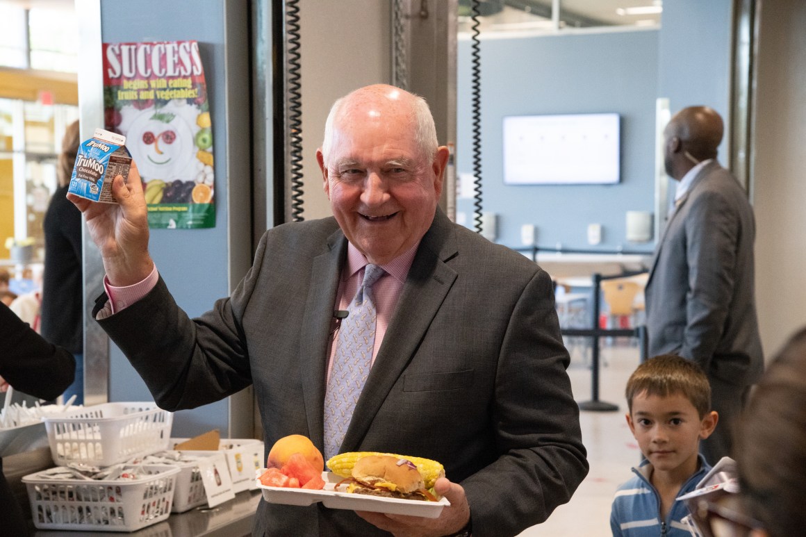 Secretary of Agriculture Sonny Perdue holds up his chocolate milk drink at Discovery Elementary School, in Arlington, Virginia, on October 18th, 2018.