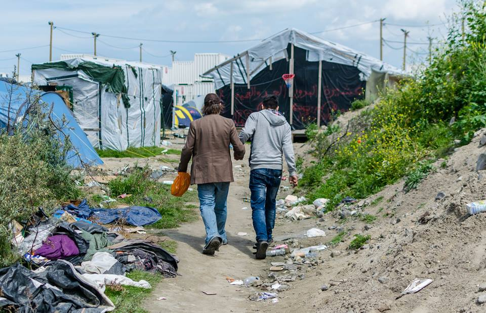 During one of James Pearce's 2016 visits to the Calais Jungle, a refugee member of PC4R recognized him from far away, greeted him warmly, and invited him to share a meal.