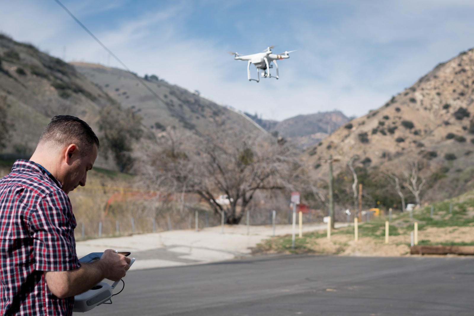 Ammar Abukarah, a longtime resident of Porter Ranch, flies his recreational drone over Aliso Canyon to get a better view of the leak site. Many hiking paths into the canyon have been blocked by the Southern California Gas Company security contractors, leaving curious residents like Ammar to resort to other means to satisfy their curiosity.