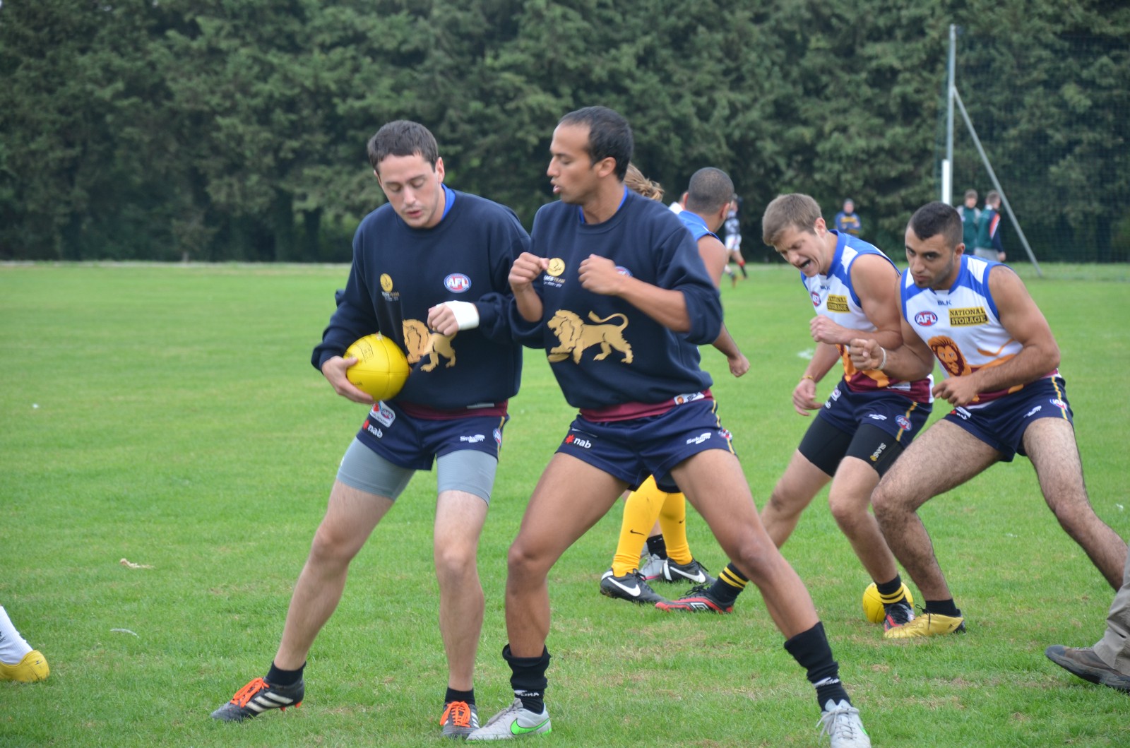 Israelis Adam Fink (left), Ethan Nechemia (right) and Yonatan Belik (rear left) and Palestinian Sadek Shanina (rear right) bump and pump up each other up before a game.