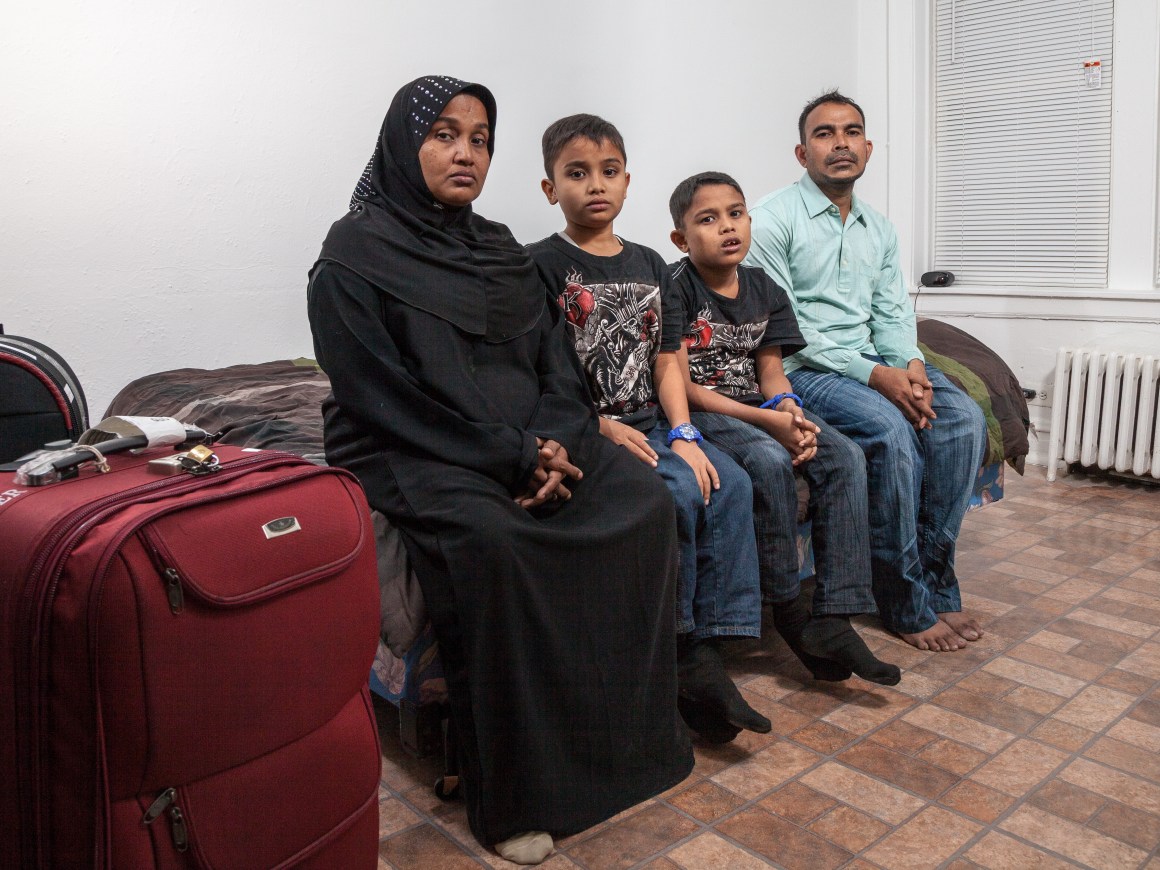 A Rohingya family, headed by mother Husnarah binti Sayad Rahman (left) and father Mohamad Nur bin Abdullah (far right), have settled in the Chicago region.