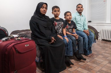 A Rohingya family, headed by mother Husnarah binti Sayad Rahman (left) and father Mohamad Nur bin Abdullah (far right), have settled in the Chicago region.