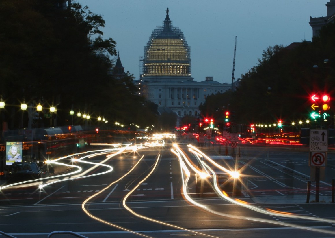 Nighttime photo showing a street approaching the Capitol building