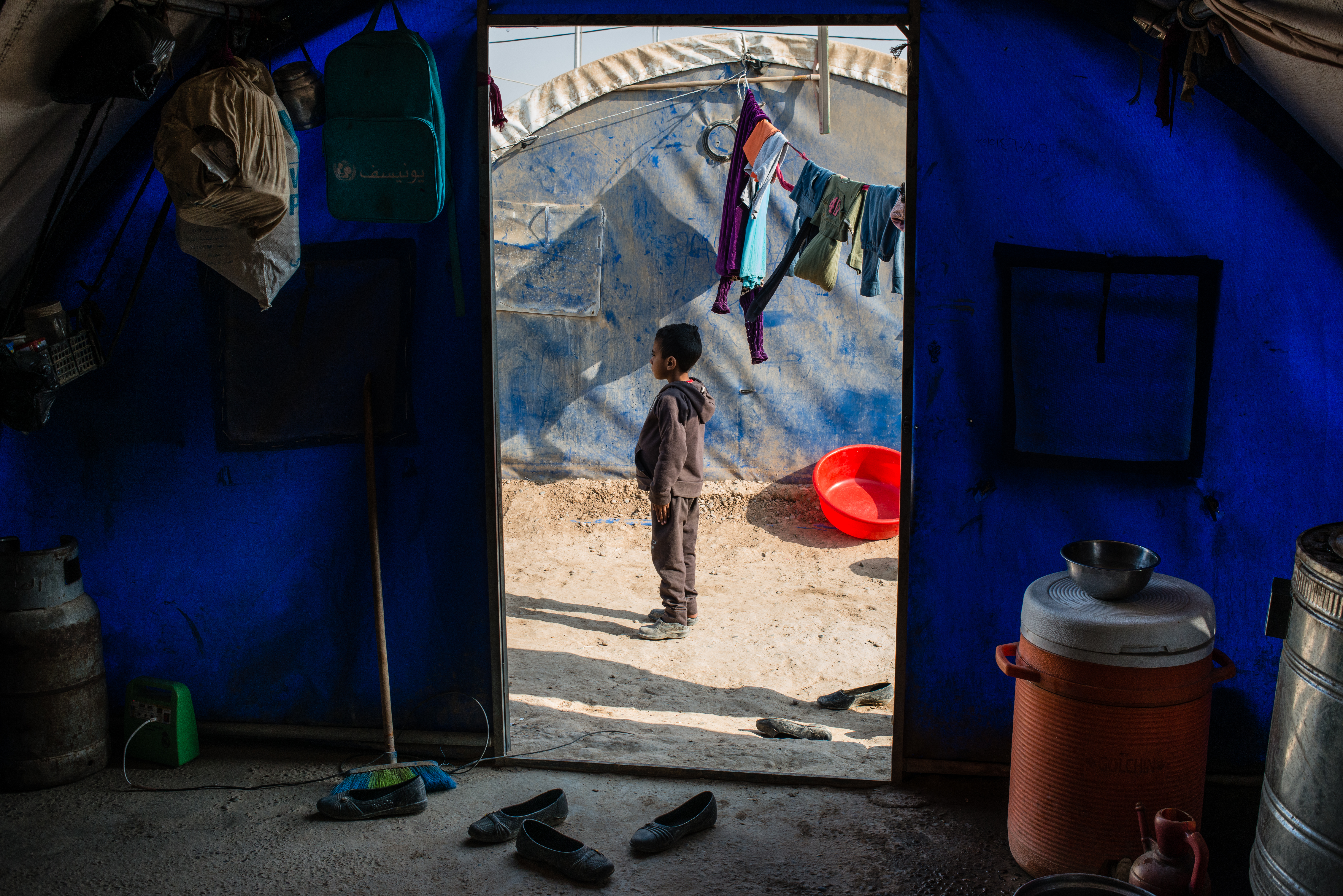 Saqer, a young Sunni boy who suffers from symptoms of post-traumatic stress disorder, lives in Qayyara Jaddah camp with his family, who won't return home for fear of retribution from Yazidi neighbors.