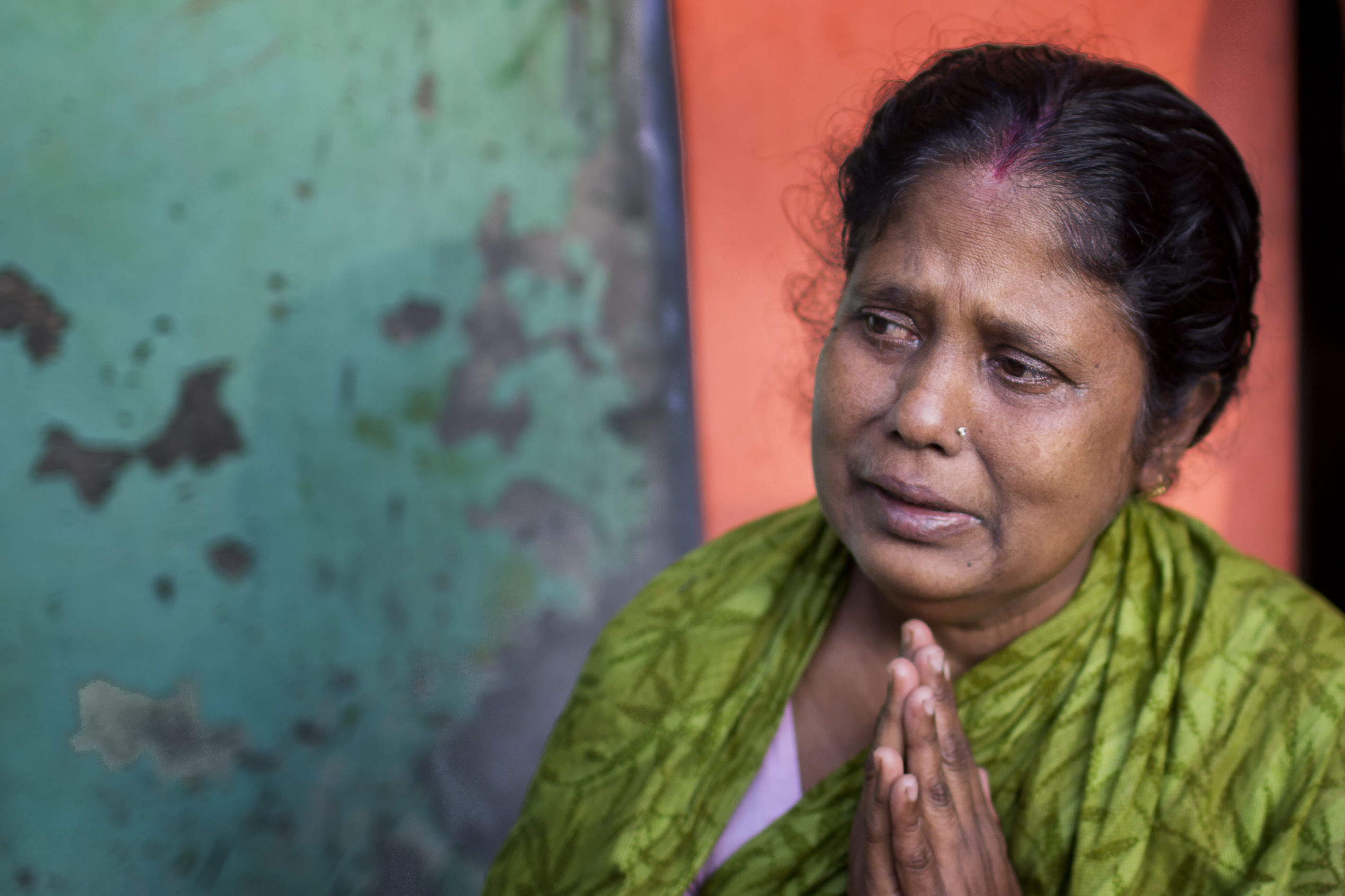 Since 2001, when Nipah virus was first recognized in Bangladesh, the pathogen has taken a heavy toll. This mother in Faridpur prays for her son who fell ill after drinking date palm sap during a gathering to celebrate his graduation from high school. He has since died.