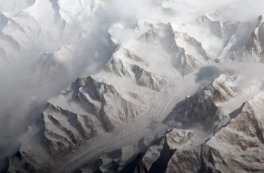 This astronaut photograph provides a view of the central Tien Shan mountains east of where the borders of China, Kyrgyzstan, and Kazakhstan meet.