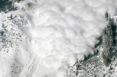 Arbaz, Switzerland: A controlled avalanche, started with dynamite, slides down a mountain in the Swiss canton of Valais.