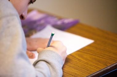 Woman girl taking standardized test school classroom