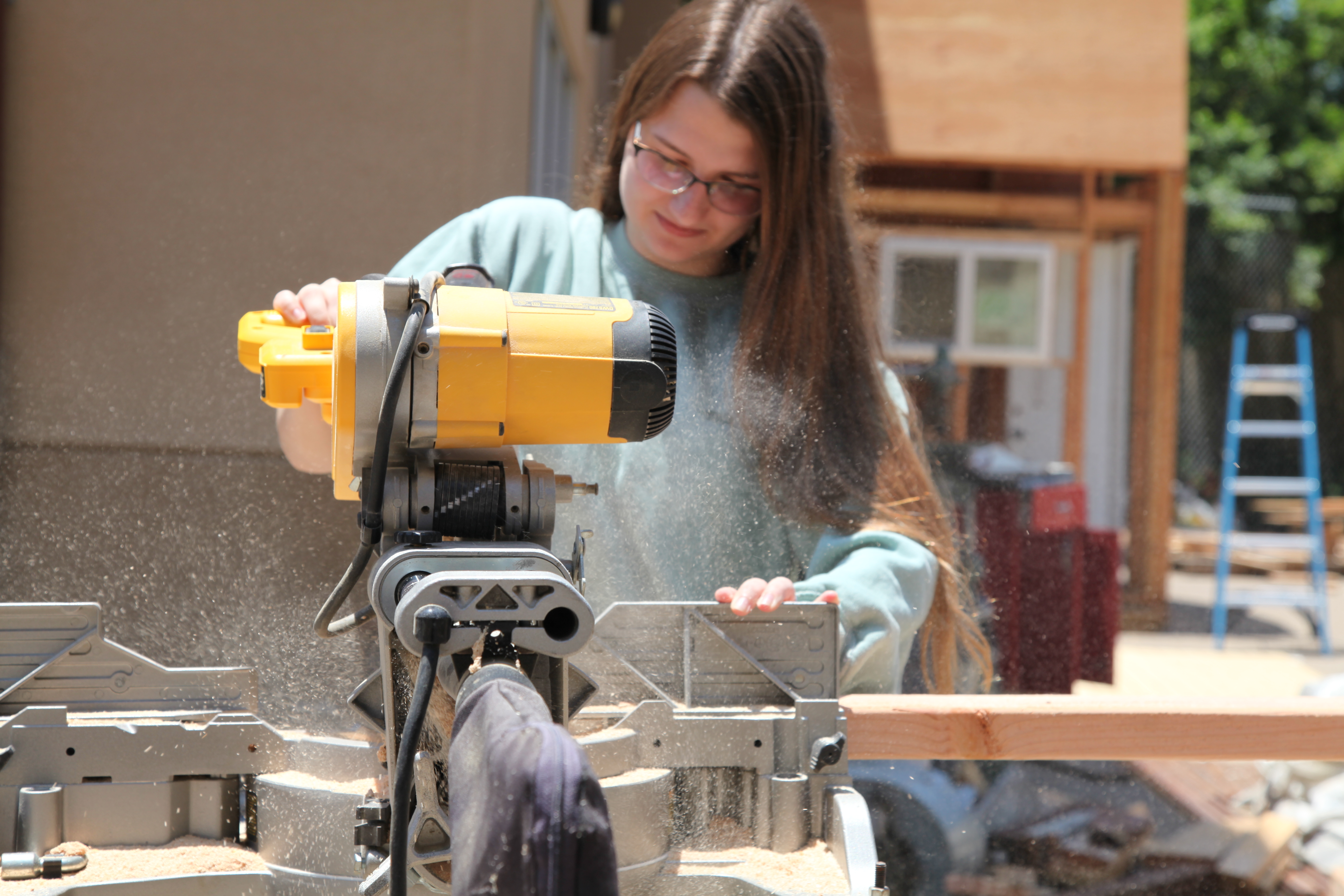 Caitlin Pierce, 17, uses a power saw during a construction class at Abraxas Continuation High School in Poway, California.